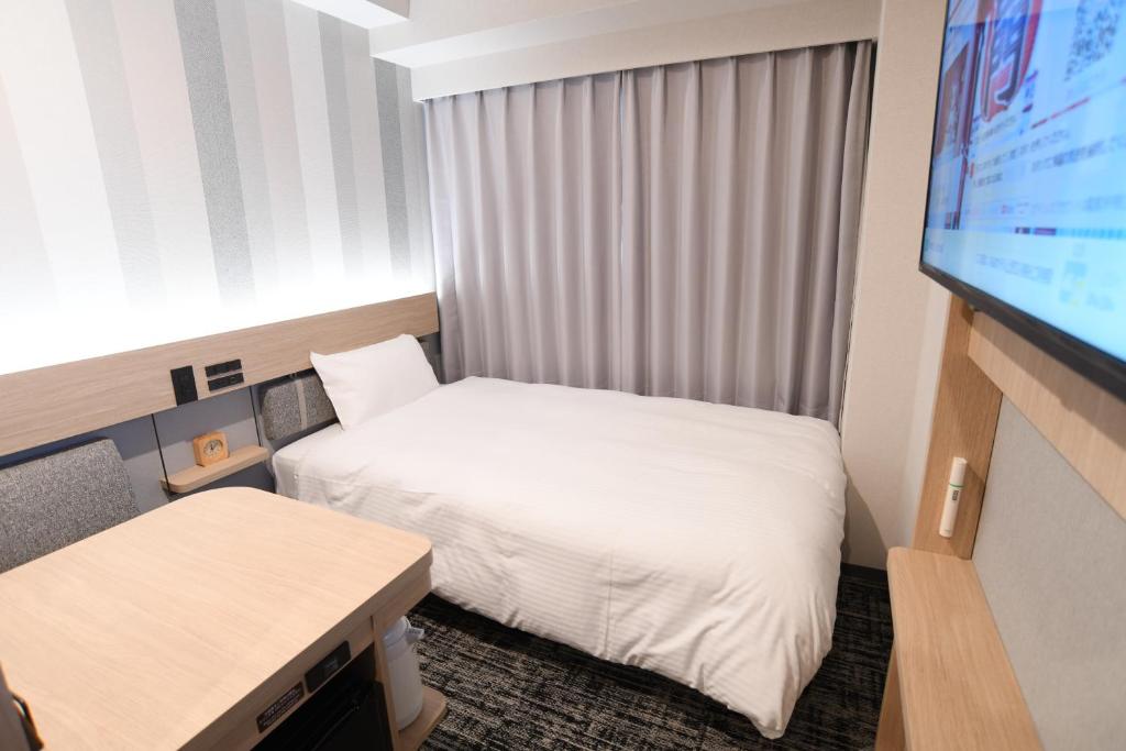 Postel nebo postele na pokoji v ubytování WASHINGTON R&B Hotel Ueno Hirokoji