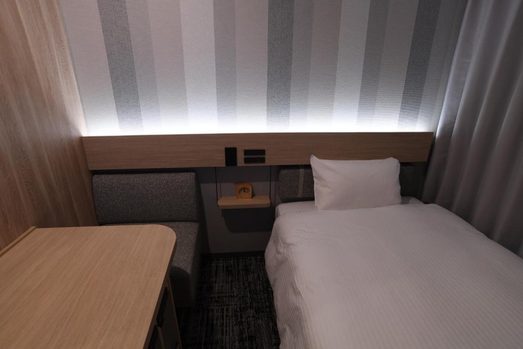 Postel nebo postele na pokoji v ubytování WASHINGTON R&B Hotel Ueno Hirokoji