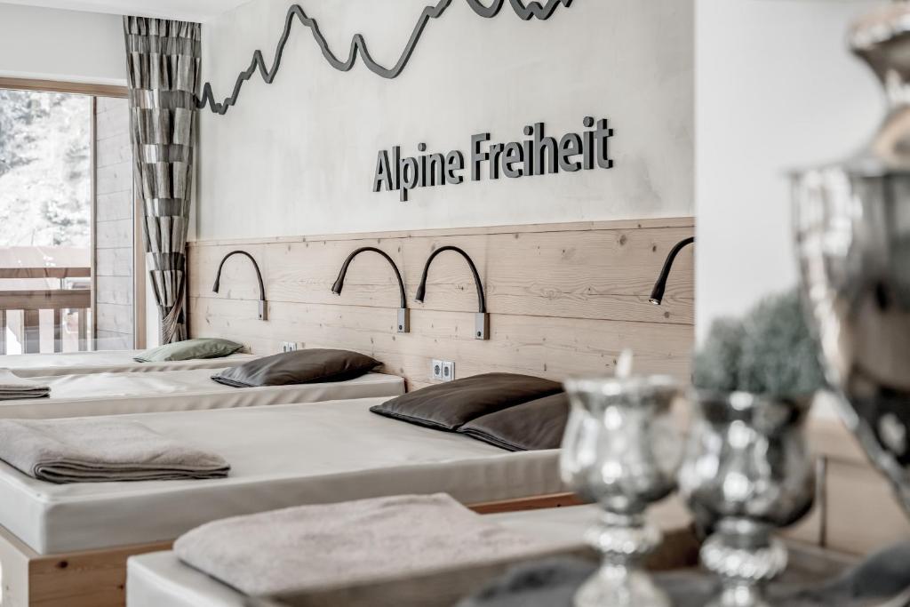 Postel nebo postele na pokoji v ubytování Hotel Jenewein