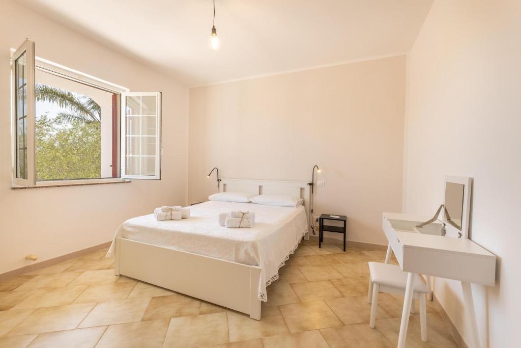 Postel nebo postele na pokoji v ubytování Villa Dolcevivere