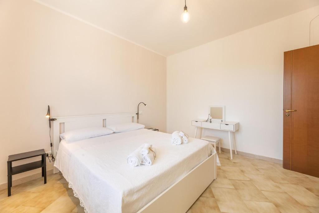 Postel nebo postele na pokoji v ubytování Villa Dolcevivere