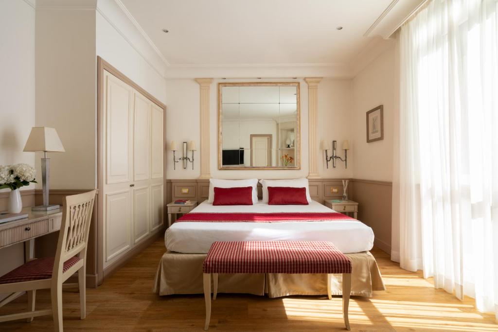 Postel nebo postele na pokoji v ubytování Hotel Villa Glori