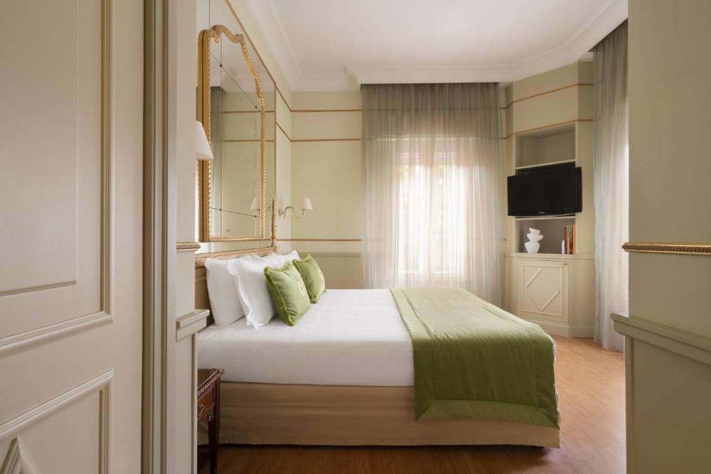 Postel nebo postele na pokoji v ubytování Hotel Degli Aranci