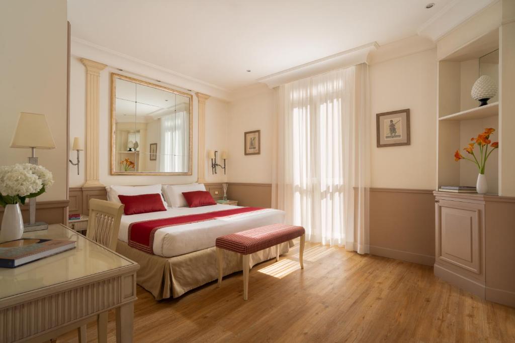 Postel nebo postele na pokoji v ubytování Hotel Villa Glori