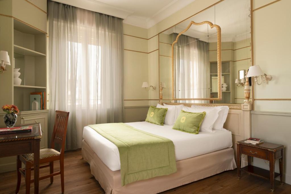 Postel nebo postele na pokoji v ubytování Hotel Degli Aranci