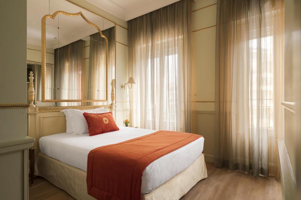 Postel nebo postele na pokoji v ubytování Hotel Degli Aranci