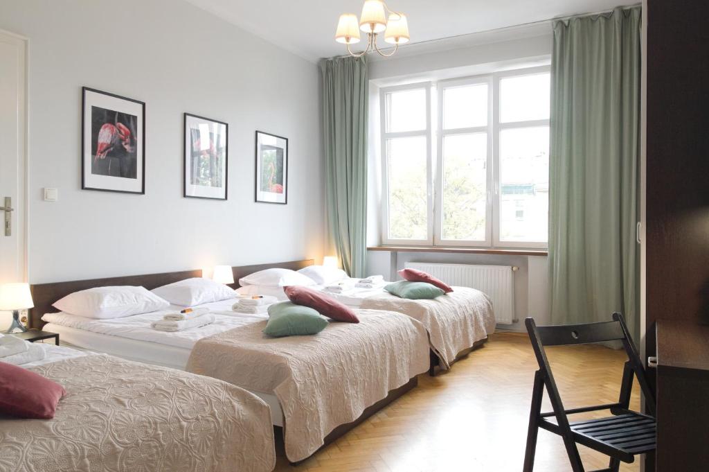 Posteľ alebo postele v izbe v ubytovaní Unique apartments Krasinskiego street