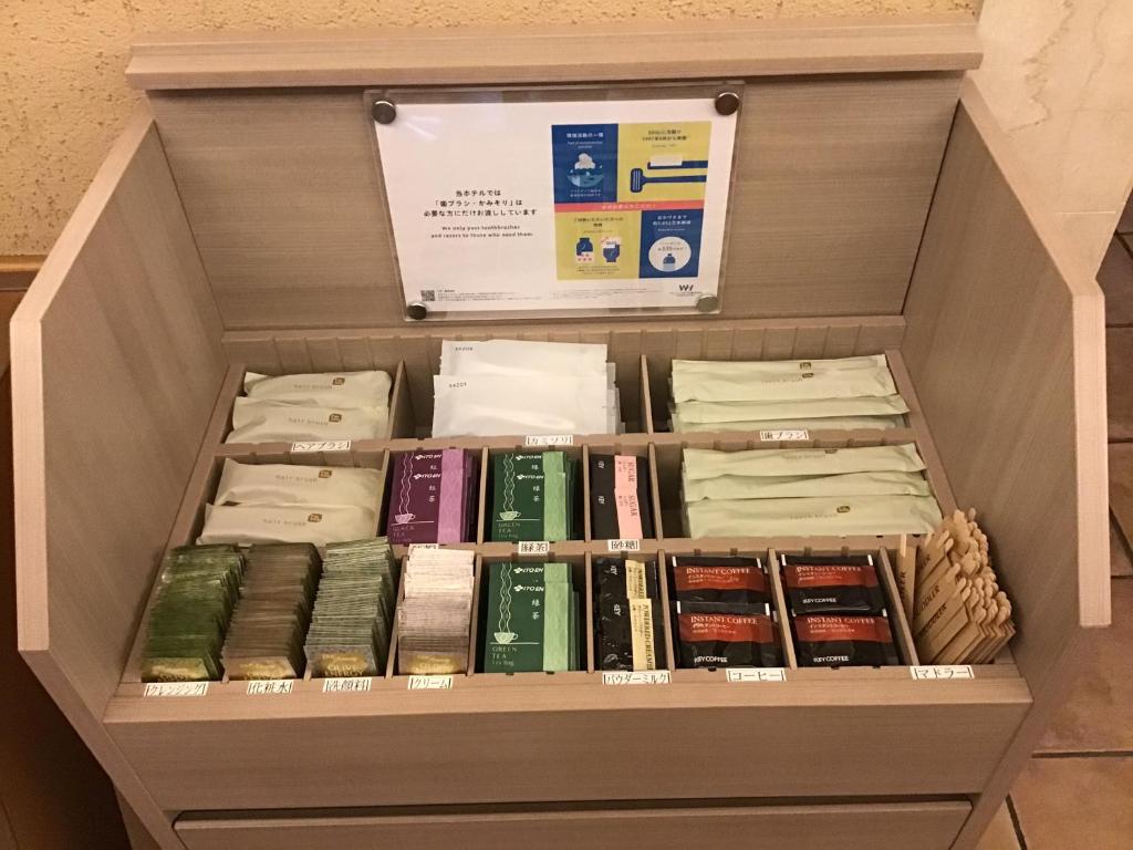 a drawer filled with lots of books at Washington R&B Hotel Hachioji in Hachioji