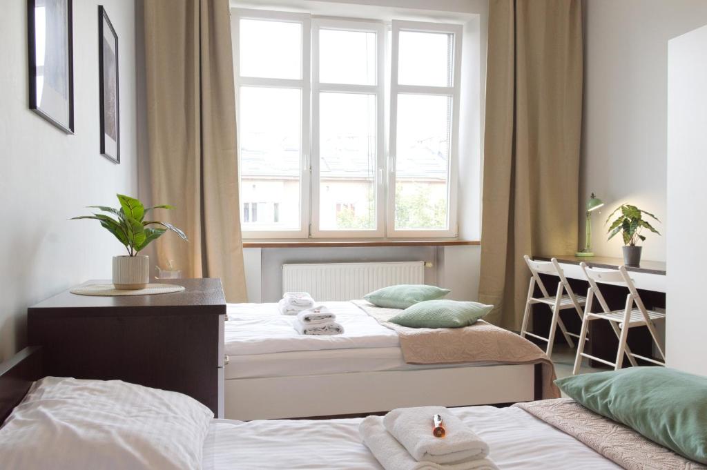 Posteľ alebo postele v izbe v ubytovaní Unique apartments Krasinskiego street