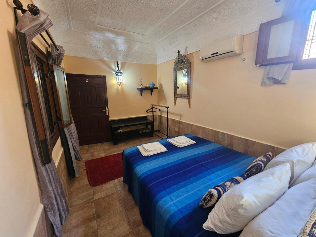 Postel nebo postele na pokoji v ubytování Riad Dar Rita