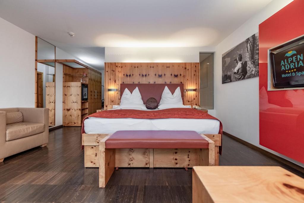 Postel nebo postele na pokoji v ubytování Alpen Adria Hotel & Spa