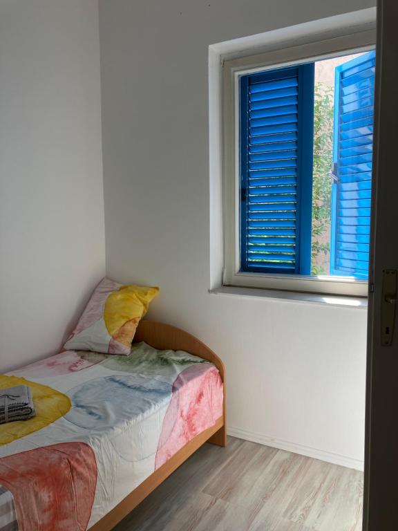 Postel nebo postele na pokoji v ubytování Sea House N1