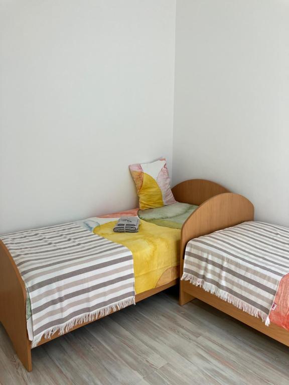Postel nebo postele na pokoji v ubytování Sea House N1