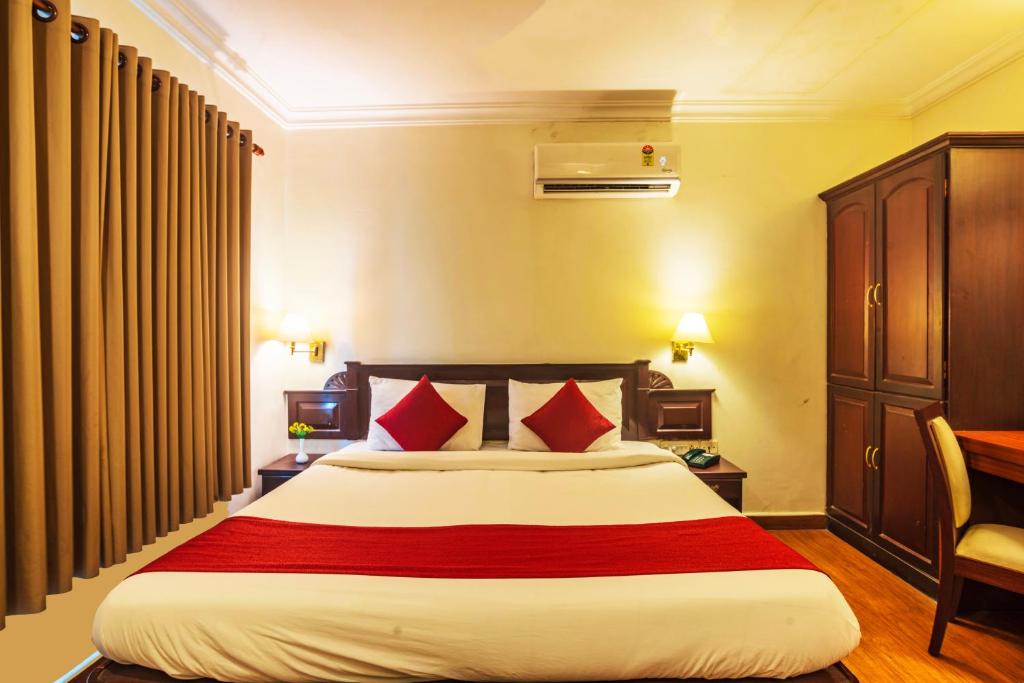 Postel nebo postele na pokoji v ubytování Hotel Archana Inn