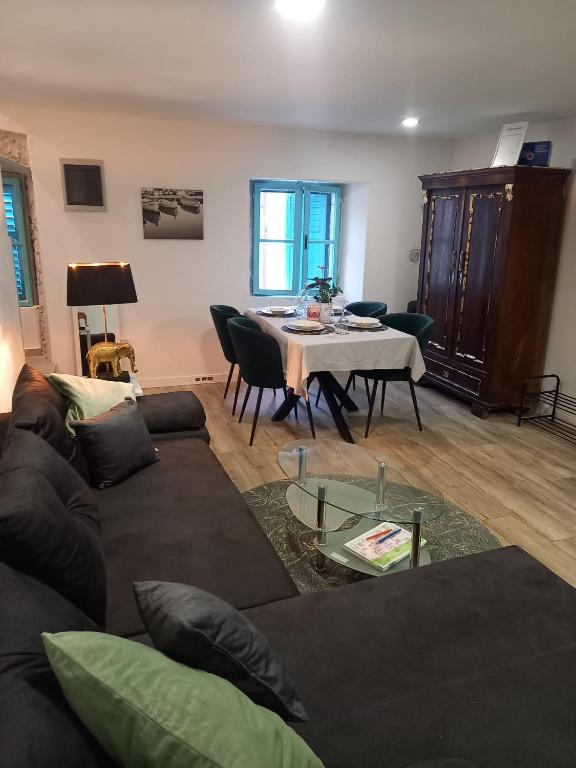 a living room with a couch and a table at Casa Benessere Istria in Vodnjan