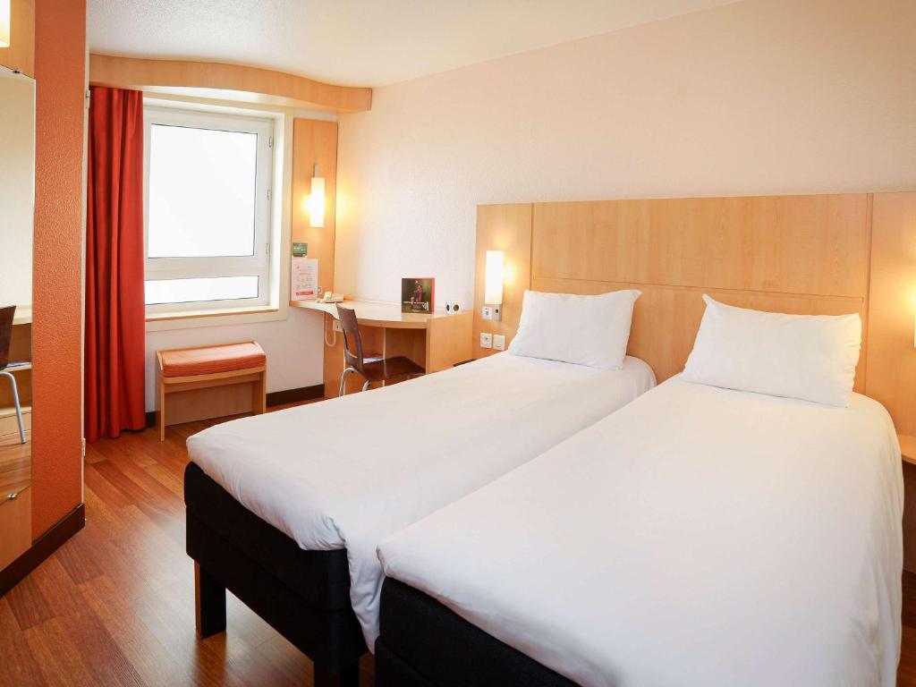 Postel nebo postele na pokoji v ubytování ibis Toulouse Centre