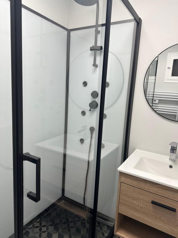 a bathroom with a shower and a sink at Maison EZA in Saint-Yrieix-sur-Charente