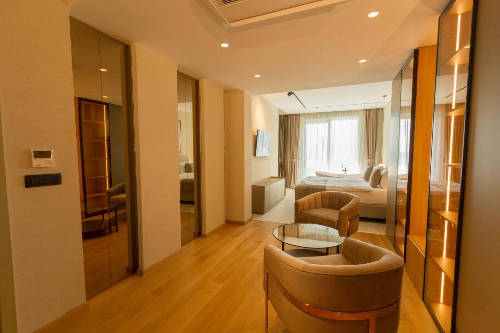 a living room with a couch and a table at Regent Resort Budva in Budva
