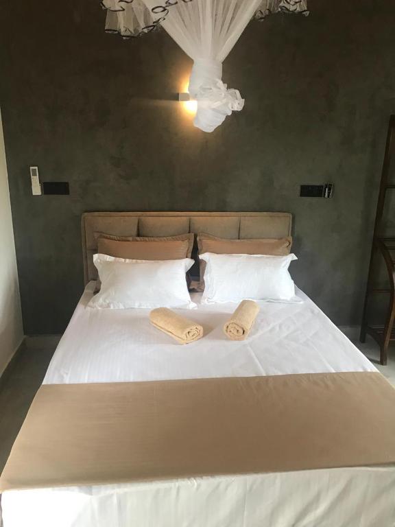 Postel nebo postele na pokoji v ubytování Flip Flop Inn Mirissa
