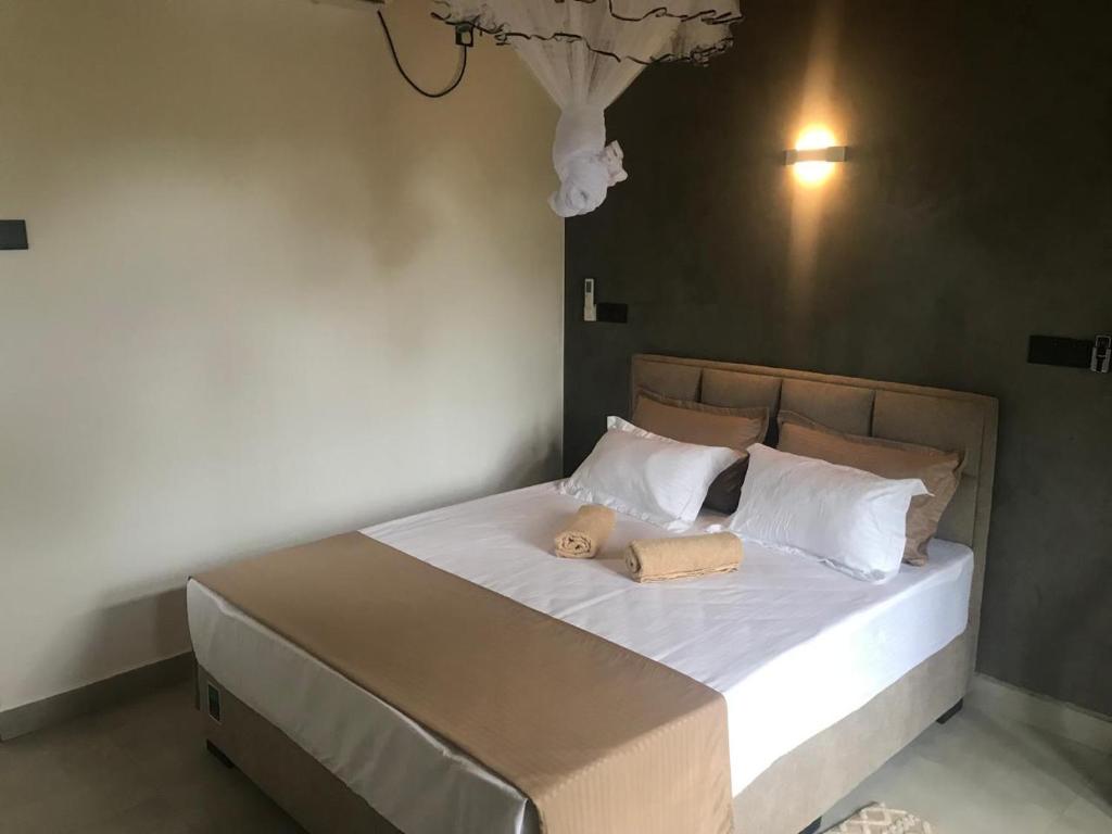 Postel nebo postele na pokoji v ubytování Flip Flop Inn Mirissa