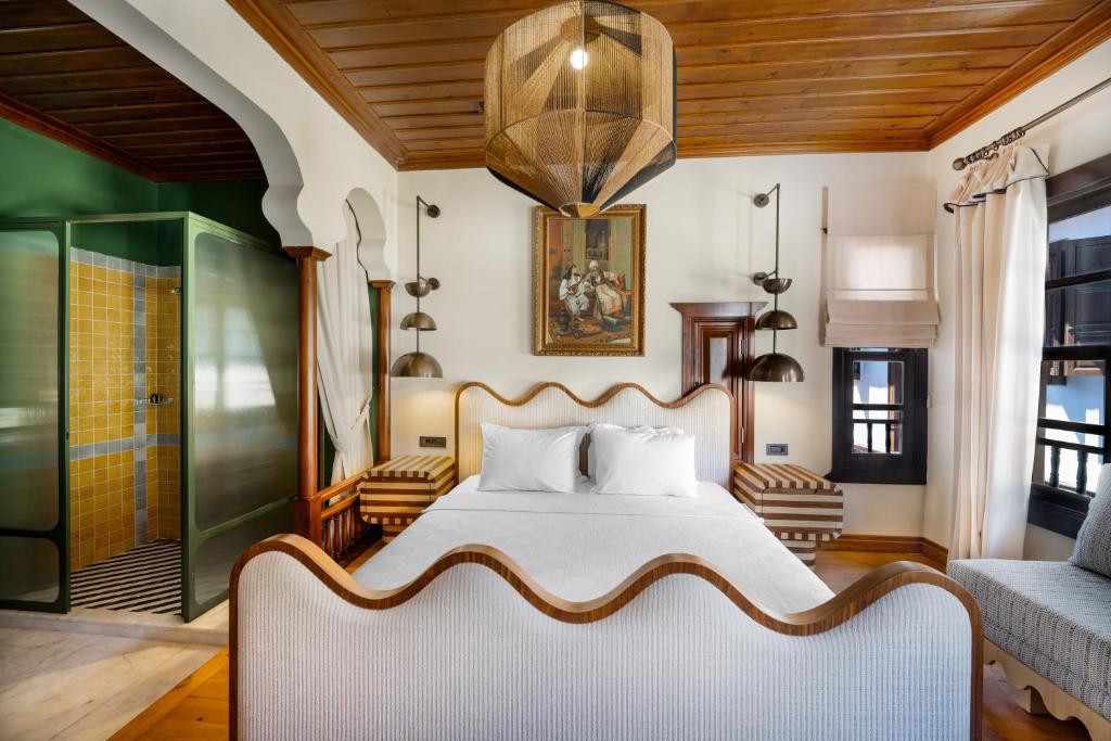 a bedroom with a bed and a couch at House 5 Hotel in Antalya