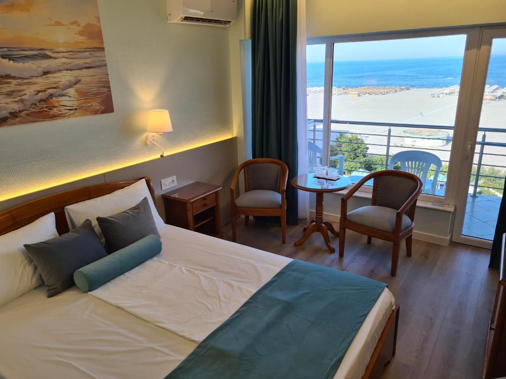 Postel nebo postele na pokoji v ubytování Hotel Comandor