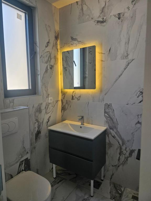 Koupelna v ubytování La Vida Apartments