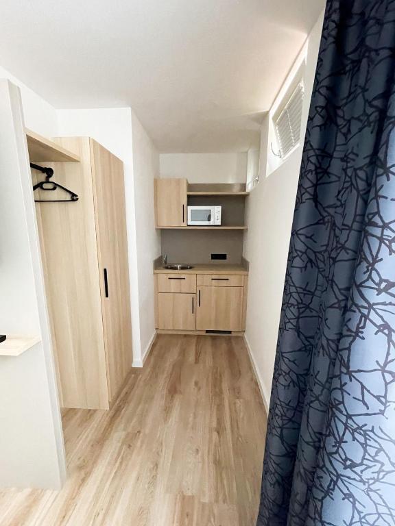 Kuchyň nebo kuchyňský kout v ubytování HOLI City Apart Hotel Berlin