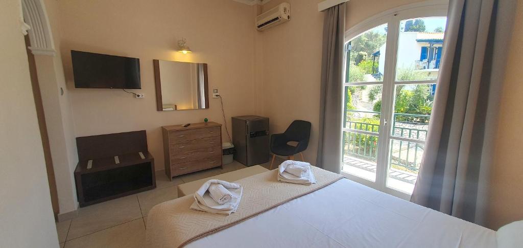 Postel nebo postele na pokoji v ubytování Paleo Inn Hotel