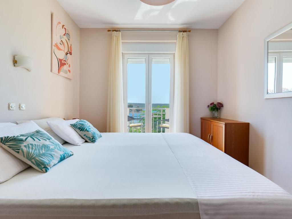 Postel nebo postele na pokoji v ubytování Apartment Daria 1 by Interhome