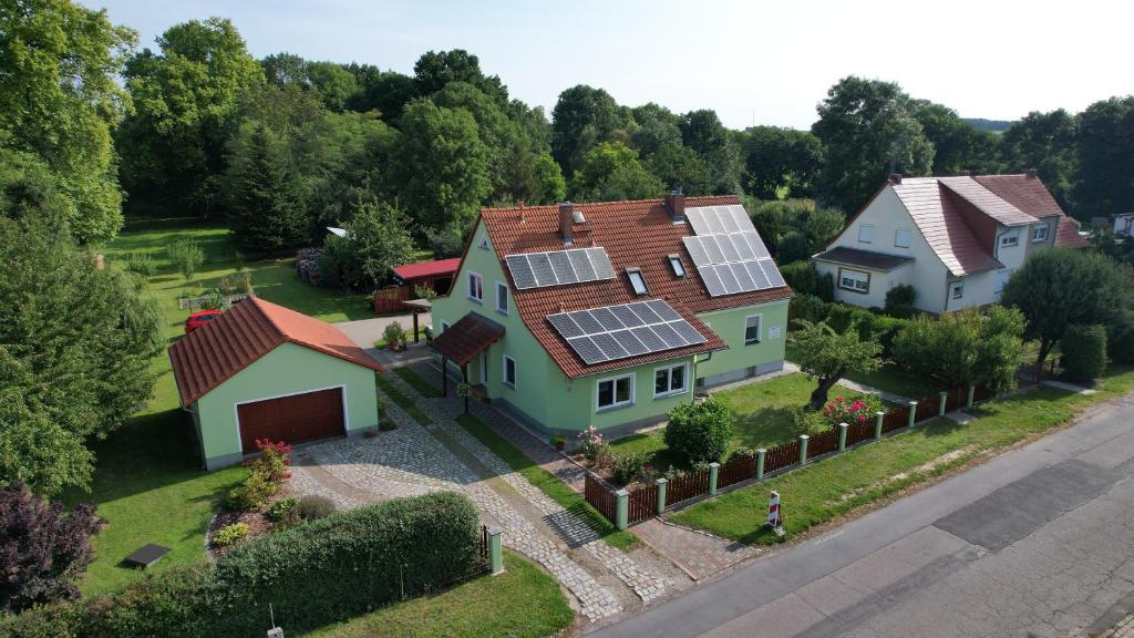 a house with solar panels on its roof at Fewo Ramin in Felchow