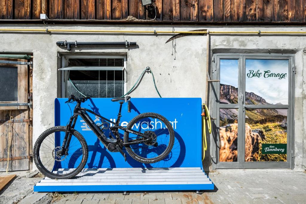 a bike parked on a ramp in front of a store at Haus Tannberg in Riezlern