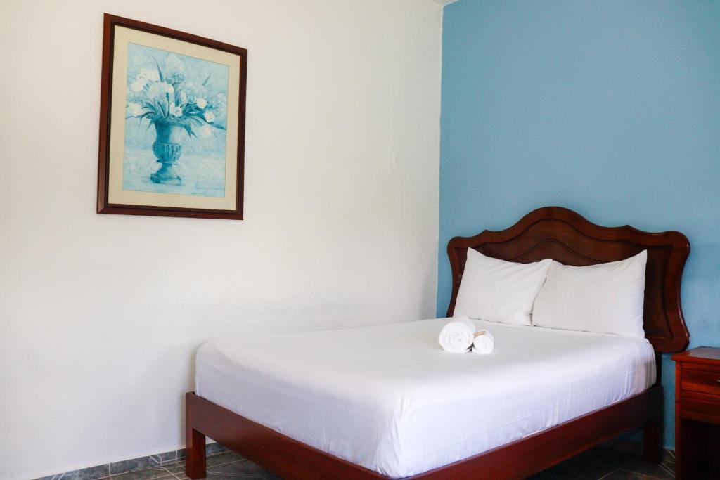 Postel nebo postele na pokoji v ubytování Hotel Quinta Izamal