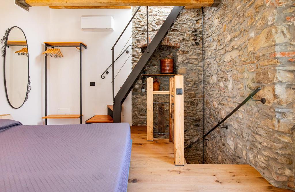 Postel nebo postele na pokoji v ubytování Pasini Luxury room,cozy winemakers retreat