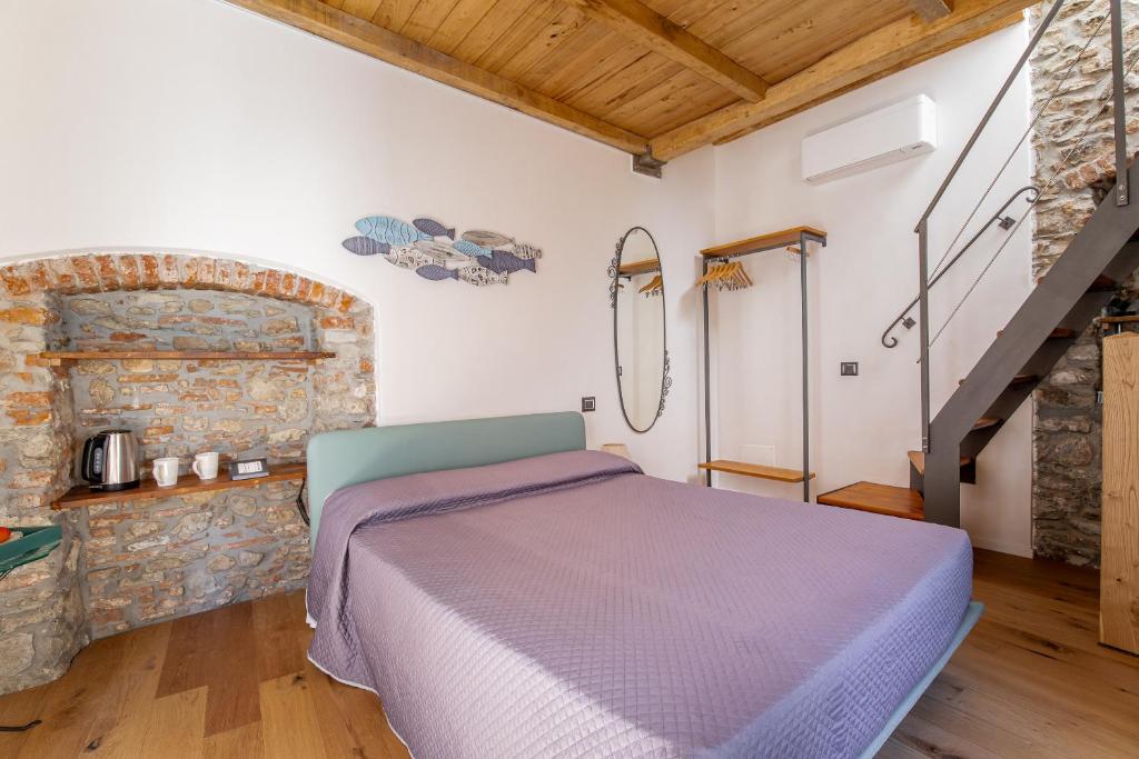 Postel nebo postele na pokoji v ubytování Pasini Luxury room,cozy winemakers retreat