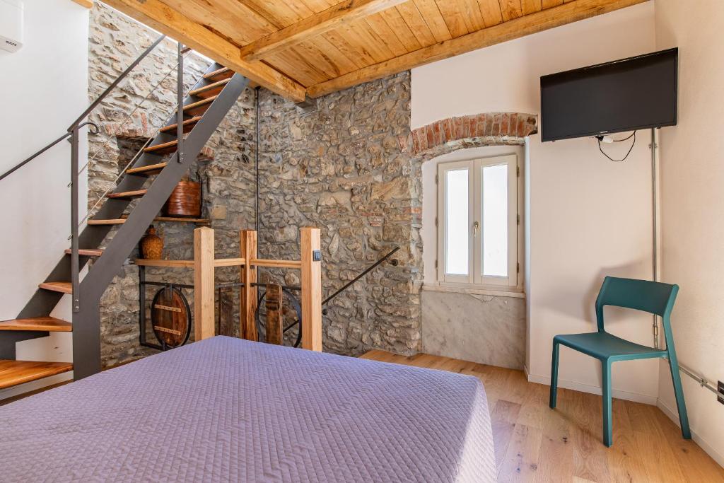 Postel nebo postele na pokoji v ubytování Pasini Luxury room,cozy winemakers retreat