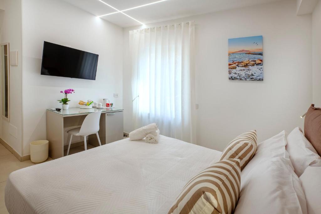 Postel nebo postele na pokoji v ubytování B&B GargiuloFamily