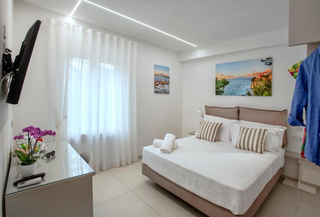 Postel nebo postele na pokoji v ubytování B&B GargiuloFamily