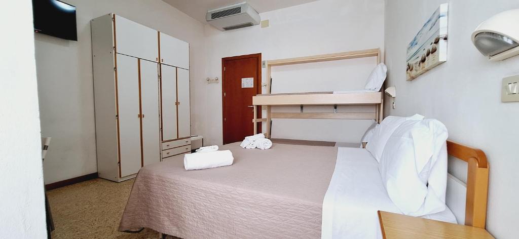 Postel nebo postele na pokoji v ubytování Hotel Sasselli