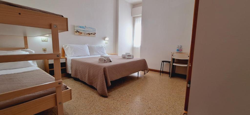 Postel nebo postele na pokoji v ubytování Hotel Sasselli