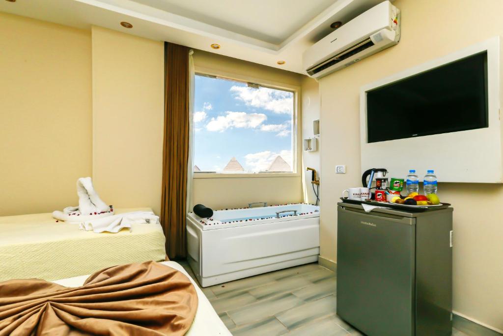 TV a/nebo společenská místnost v ubytování Venus Pyramids-Guest House