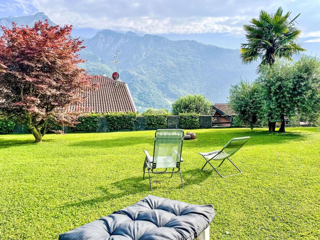 a couch and two chairs sitting in a yard at Apartment DaNina by Interhome in Abbadia Lariana