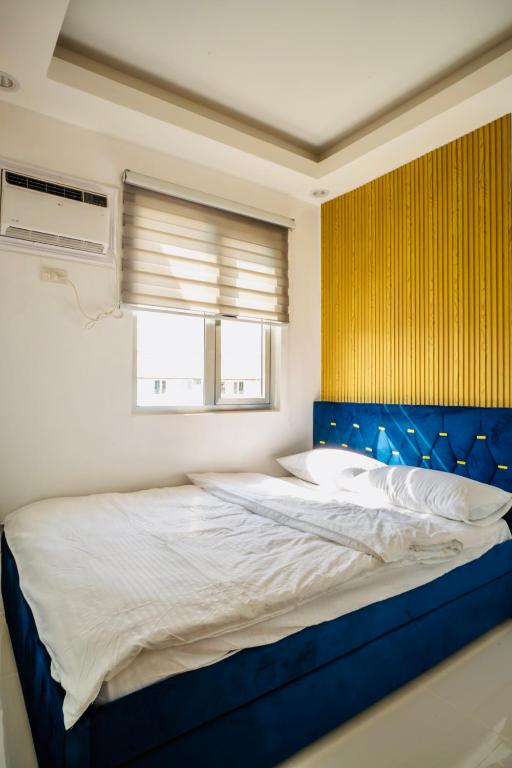 Postel nebo postele na pokoji v ubytování Rendez-vous 2BR Condo Unit at SMDC Cheer