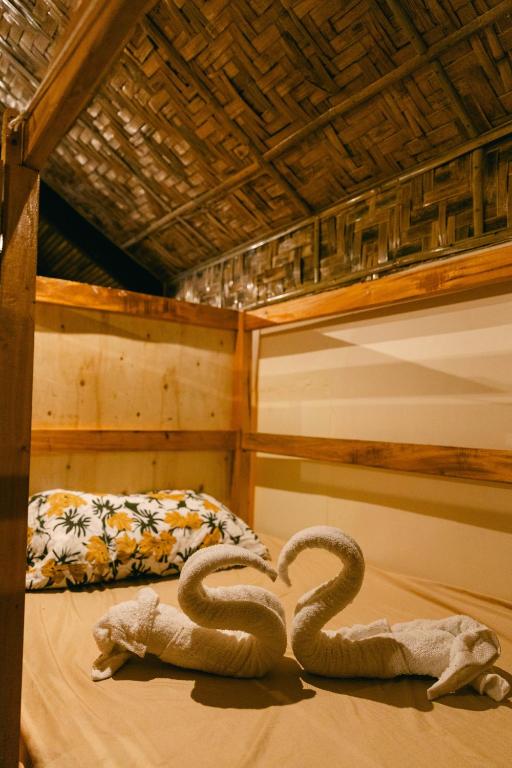 Postel nebo postele na pokoji v ubytování katana siargao