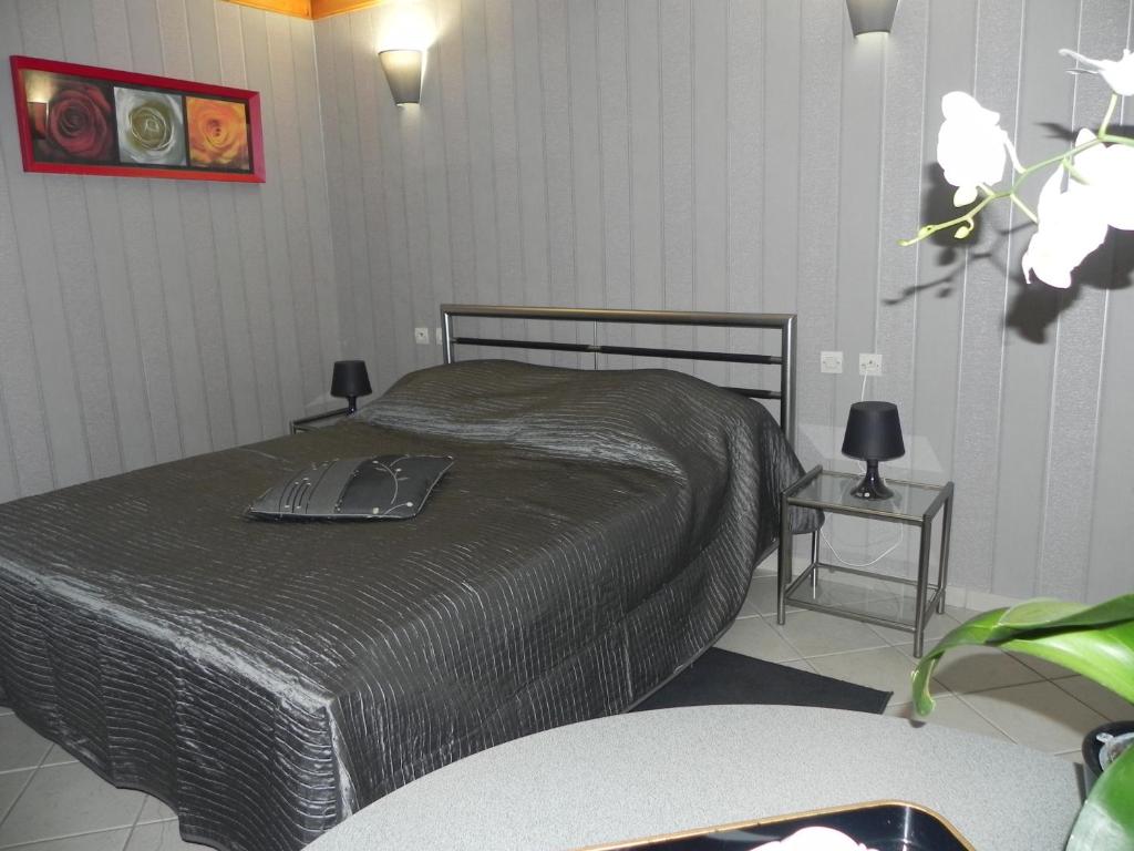 Postel nebo postele na pokoji v ubytování Les Charmilles