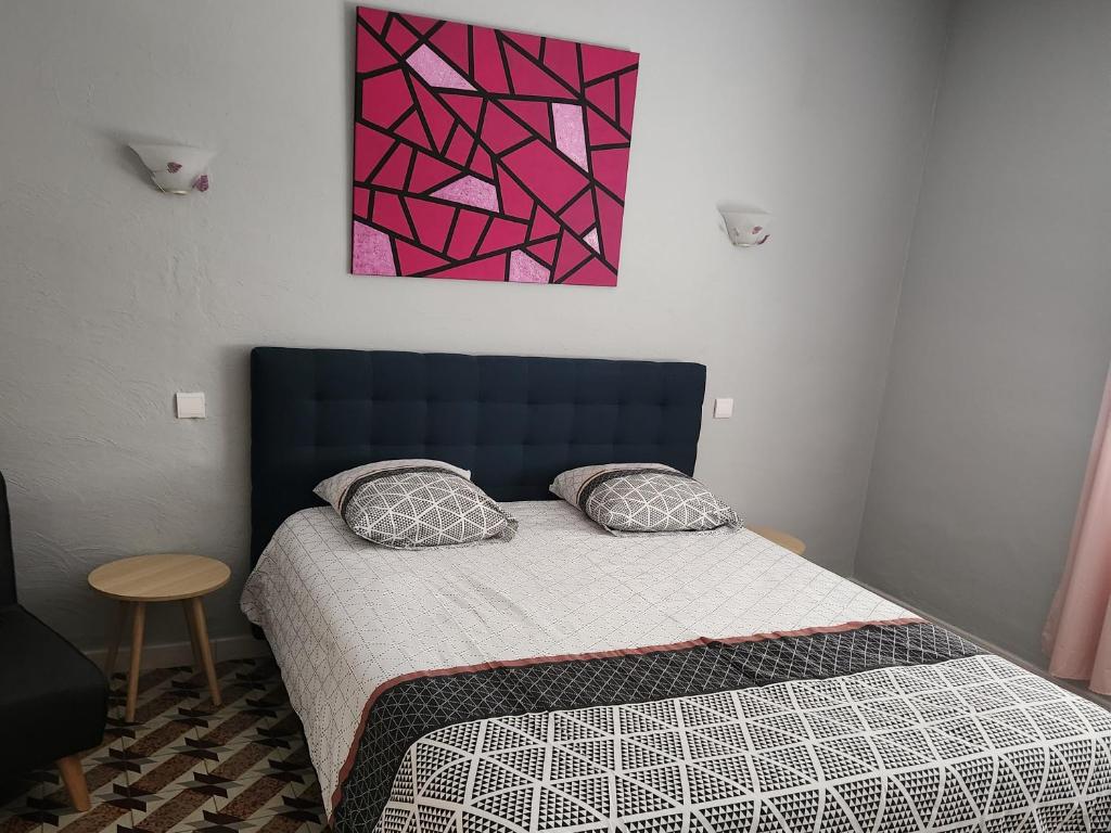 Postel nebo postele na pokoji v ubytování Les Belles Nuits