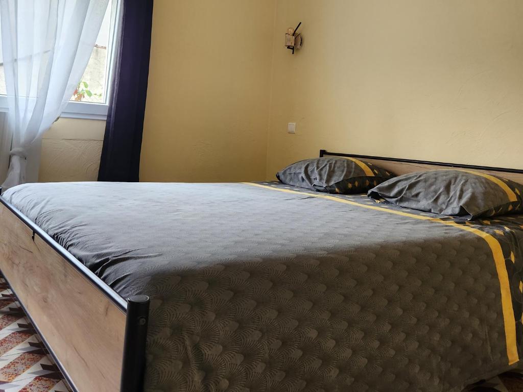 Postel nebo postele na pokoji v ubytování Les Belles Nuits