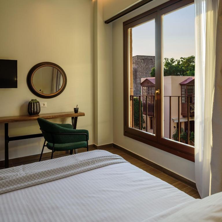 Postel nebo postele na pokoji v ubytování Arthur Suites in Old Town