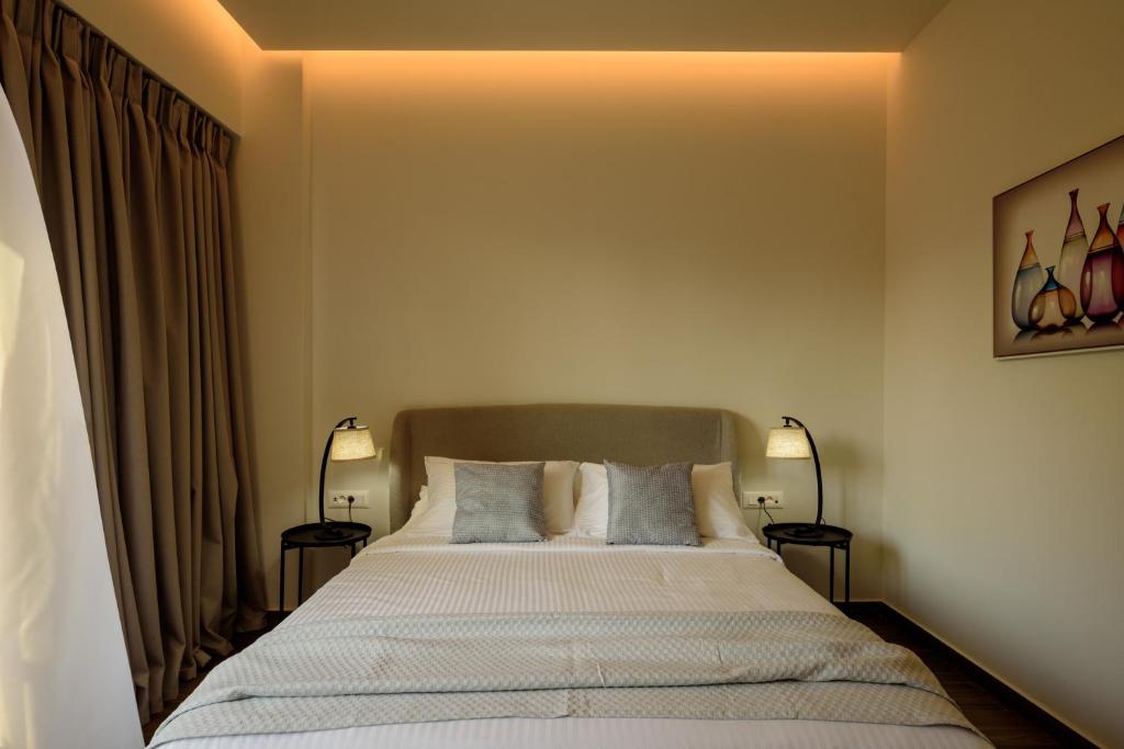 Postel nebo postele na pokoji v ubytování Arthur Suites in Old Town