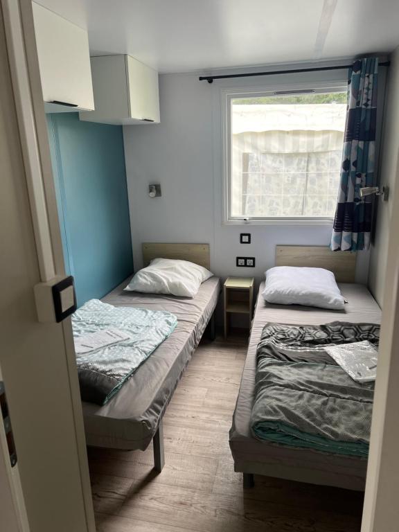 Postel nebo postele na pokoji v ubytování Camping Pen Guen